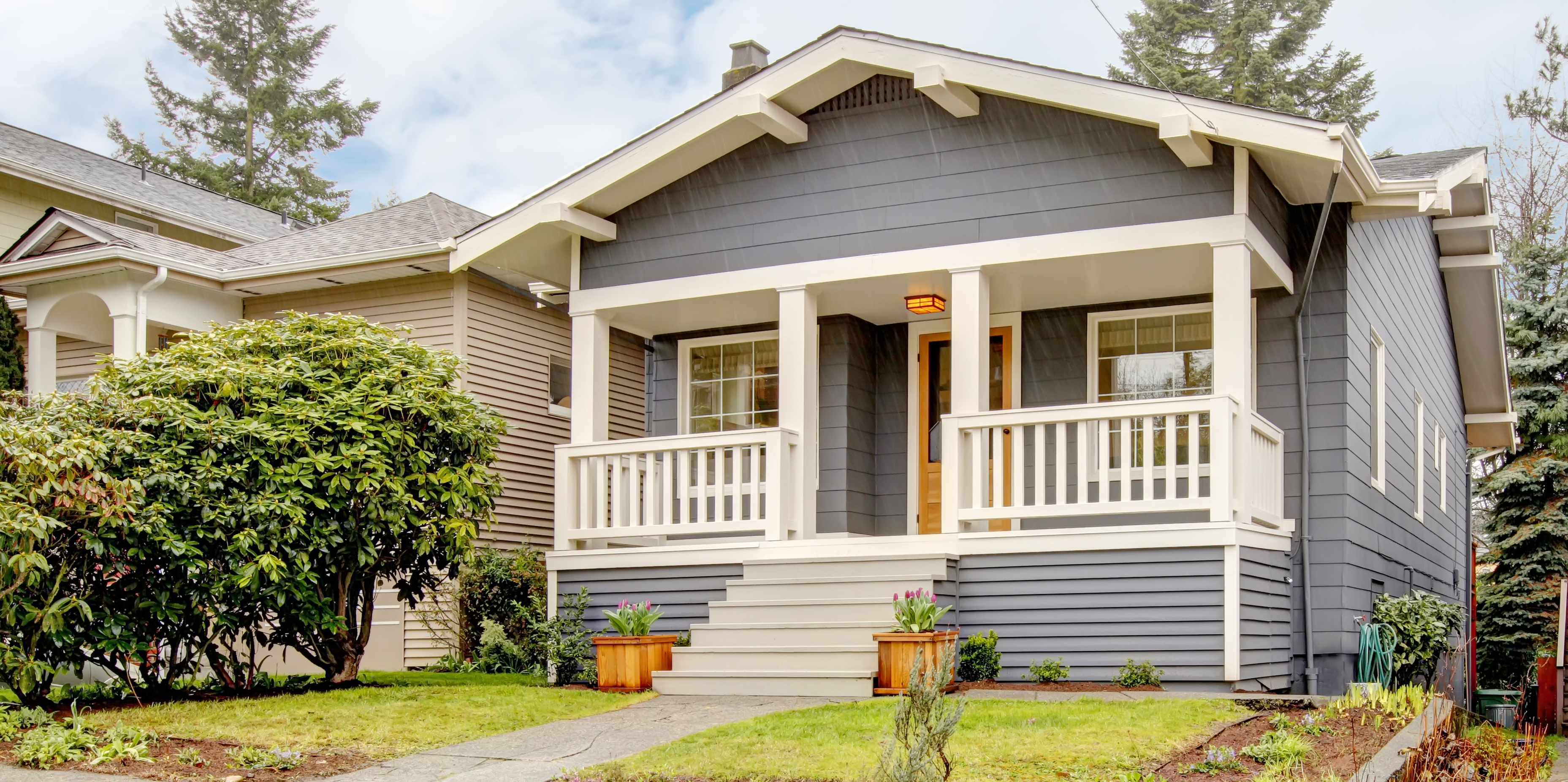 Home exterior, grey house with porch and yard